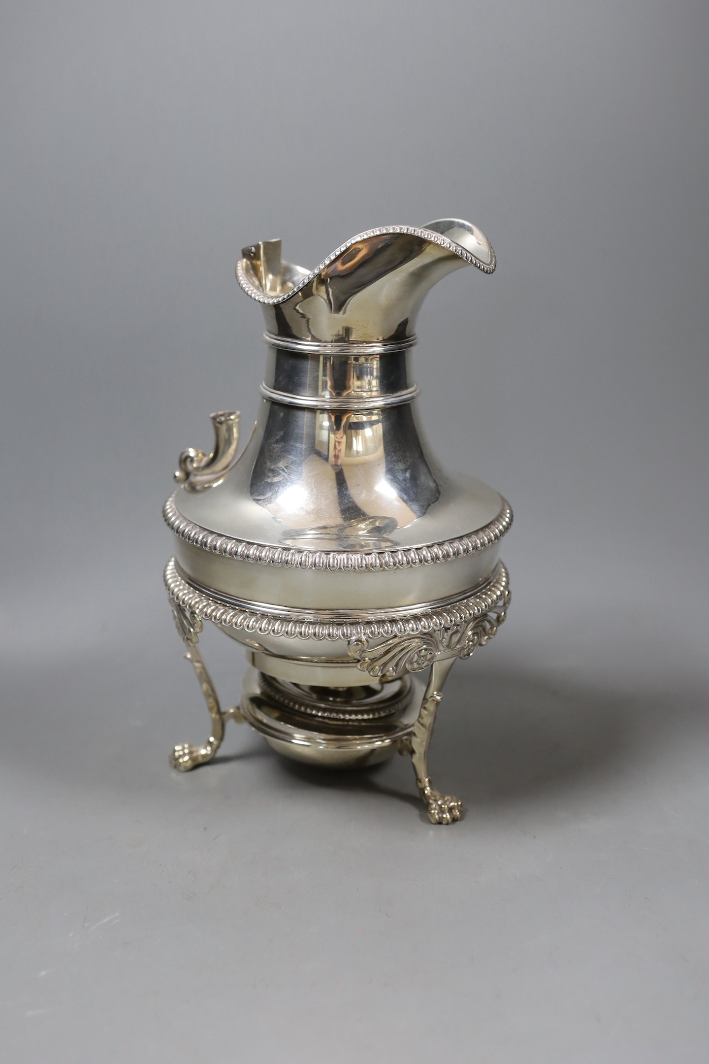 A George III silver hot water/coffee pot, on stand, with burner, George Smith II, London, 1813, lacking handle, overall height 25.3cm